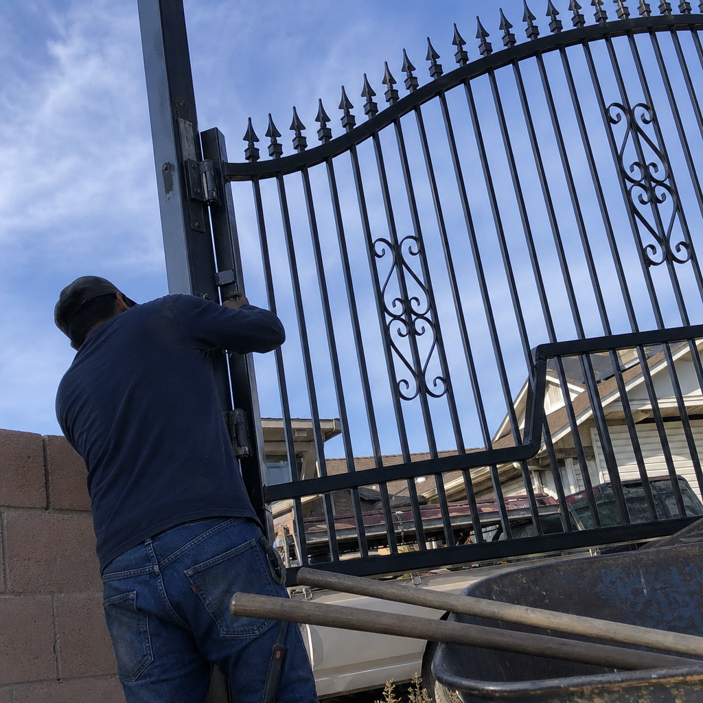 Professional contractor performing gate installation and repair work